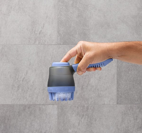 Bath brush with container in a minimalist bathroom setup